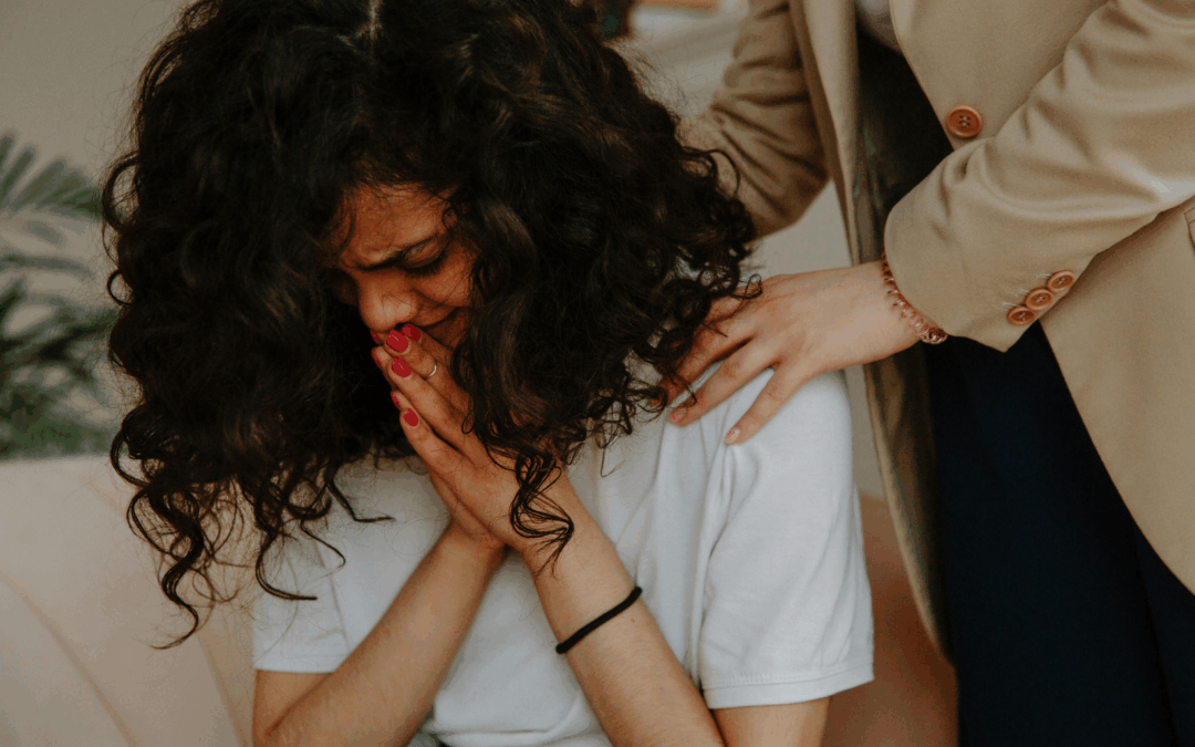 person being comforted by therapist